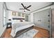 This bedroom features hardwood floors, a ceiling fan, and neutral walls at 2357 Lynn Iris Dr, Decatur, GA 30032