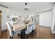 Elegant dining room with hardwood floors, modern lighting, and an open layout connecting to a stylish kitchen at 2357 Lynn Iris Dr, Decatur, GA 30032