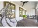 Cozy front porch with stylish hanging chair and comfortable seating; perfect for relaxing outdoors at 2357 Lynn Iris Dr, Decatur, GA 30032