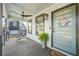 Inviting front porch with stylish hanging chair, ceiling fan, and a beautifully decorated front door at 2357 Lynn Iris Dr, Decatur, GA 30032