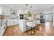 Bright kitchen island with stainless steel appliances, sleek white cabinets, connecting to the living room at 2357 Lynn Iris Dr, Decatur, GA 30032