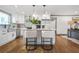 Bright kitchen island with stainless steel appliances, sleek white cabinets, and counter seating, perfect for entertaining at 2357 Lynn Iris Dr, Decatur, GA 30032
