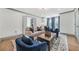 Inviting living room featuring a neutral sofa, blue armchairs, and a stylish area rug at 2357 Lynn Iris Dr, Decatur, GA 30032