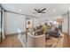 Comfortable living room with stylish furniture and a ceiling fan, connected to a modern kitchen at 2357 Lynn Iris Dr, Decatur, GA 30032
