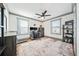 This home office features natural light, a ceiling fan, and hardwood floors at 2357 Lynn Iris Dr, Decatur, GA 30032