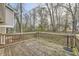 Private deck with weathered wood and railing. Features an umbrella stand at 2436 Wilshire Ct, Decatur, GA 30035
