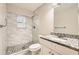 Stylish bathroom featuring tiled shower, granite countertop, and modern fixtures at 2436 Wilshire Ct, Decatur, GA 30035