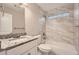 Elegant bathroom with tiled tub, granite countertop, and ample lighting at 2436 Wilshire Ct, Decatur, GA 30035