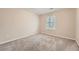 Cozy carpeted bedroom offering ample natural light from a window at 2436 Wilshire Ct, Decatur, GA 30035