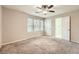 Bright bedroom featuring plush carpeting and an en suite bathroom with tiled shower at 2436 Wilshire Ct, Decatur, GA 30035