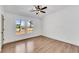 Bedroom featuring hardwood floors, white walls, trim, and a window offering bright natural light at 2681 Beckwith Se Trl, Marietta, GA 30068