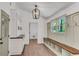 Cozy mudroom featuring a built-in bench with storage and a stylish pendant light at 2681 Beckwith Se Trl, Marietta, GA 30068