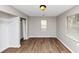 Bedroom with wood flooring, neutral paint and a window offering natural light at 346 Henry Aaron Sw Ave, Atlanta, GA 30310