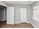 Well-lit bedroom featuring wood floors, a closet, and a window for natural light at 346 Henry Aaron Sw Ave, Atlanta, GA 30310