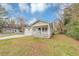 Charming single-story home with a welcoming front porch and covered parking on a grassy lot at 346 Henry Aaron Sw Ave, Atlanta, GA 30310