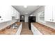 Kitchen features white cabinets, wood-look floors, gray walls, stainless sink, and plenty of counter space at 346 Henry Aaron Sw Ave, Atlanta, GA 30310