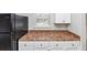 Kitchen features white cabinets, stylish countertops, and updated appliances at 346 Henry Aaron Sw Ave, Atlanta, GA 30310