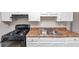 Kitchen features white cabinets, stylish countertops, and updated stove/oven at 346 Henry Aaron Sw Ave, Atlanta, GA 30310