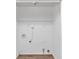 Clean laundry room with floating shelf and wood-look flooring at 346 Henry Aaron Sw Ave, Atlanta, GA 30310