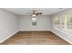 Bright and airy living room showcasing wood floors, a ceiling fan, and sun-filled windows at 346 Henry Aaron Sw Ave, Atlanta, GA 30310