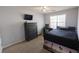 Bedroom with a TV, dresser, ceiling fan and carpeted floors at 642 Towering Pine Trl, Lawrenceville, GA 30043