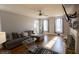 Living room featuring hardwood floors, a fireplace, and a flat screen television at 642 Towering Pine Trl, Lawrenceville, GA 30043