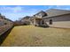 Large backyard with a well-maintained lawn, patio, and privacy fence, perfect for outdoor entertaining at 644 Crystal Cove Ct, Loganville, GA 30052