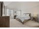 Bright bedroom with vaulted ceiling, neutral walls, and a large window at 644 Crystal Cove Ct, Loganville, GA 30052