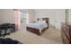 Bright bedroom with vaulted ceilings and neutral colors offers a calm retreat at 644 Crystal Cove Ct, Loganville, GA 30052