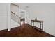 Inviting foyer with hardwood floors, a staircase, and views into the formal living room at 644 Crystal Cove Ct, Loganville, GA 30052