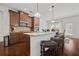 Modern kitchen featuring stainless steel appliances, a large island, and hardwood floors at 644 Crystal Cove Ct, Loganville, GA 30052