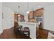 Well-lit kitchen with granite countertops, stainless steel appliances, and wooden cabinets at 644 Crystal Cove Ct, Loganville, GA 30052