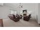 Spacious living room with a stone fireplace, plush carpeting, and ample seating at 644 Crystal Cove Ct, Loganville, GA 30052