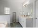 Bathroom featuring double sinks, tile floors, large mirror and natural light at 1772 Ascot Nw Run, Acworth, GA 30102
