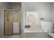 Bright bathroom featuring a soaking tub, shower and natural light from a window at 1772 Ascot Nw Run, Acworth, GA 30102