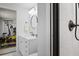 Modern bathroom featuring white subway tile, updated vanity, and black fixtures with gym in background at 1772 Ascot Nw Run, Acworth, GA 30102