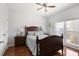 Bedroom with wood floors, a double window, and ceiling fan at 1772 Ascot Nw Run, Acworth, GA 30102
