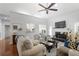 Bright and airy living room features a fireplace, ceiling fan and hardwood floors; a relaxing space at 1772 Ascot Nw Run, Acworth, GA 30102