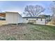 Home exterior with deck and storage structure, nestled in a grassy yard at 5205 Silhouette Sw Ln, Mableton, GA 30126