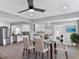 Bright dining room with modern ceiling fan, flows into the kitchen with stainless appliances at 5205 Silhouette Sw Ln, Mableton, GA 30126