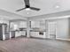 Bright living room with neutral paint and vinyl plank flooring flows into the kitchen at 5205 Silhouette Lane Sw, Mableton, GA 30126