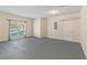 A brightly lit basement, with a window and gray floors at 649 Woodcrest Manor Dr, Stone Mountain, GA 30083