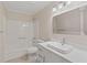 All-white bathroom featuring a modern vanity, faucet, and tub with shower at 649 Woodcrest Manor Dr, Stone Mountain, GA 30083