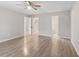 Spacious bedroom showcasing laminate flooring and views to the hallway and bathroom at 649 Woodcrest Manor Dr, Stone Mountain, GA 30083