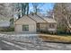 Charming single-Gathering home with a well-maintained front yard, attached garage, and inviting entrance at 649 Woodcrest Manor Dr, Stone Mountain, GA 30083