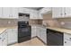 The kitchen features white cabinets, granite countertops, and modern appliances at 649 Woodcrest Manor Dr, Stone Mountain, GA 30083