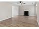Spacious living room with hardwood floors and a cozy fireplace perfect for gatherings at 649 Woodcrest Manor Dr, Stone Mountain, GA 30083