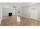 Spacious living room with hardwood floors, fireplace, and large windows for natural light at 649 Woodcrest Manor Dr, Stone Mountain, GA 30083