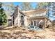 Spacious backyard featuring brick exterior, patio area and mature tree coverage at 11 Tallulah Ct, Jonesboro, GA 30236