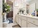 Well-lit bathroom with modern sink and decor, ample storage and shower at 11 Tallulah Ct, Jonesboro, GA 30236